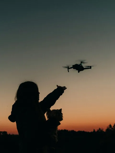 A small drone in flight, representing hands-on coding lessons.